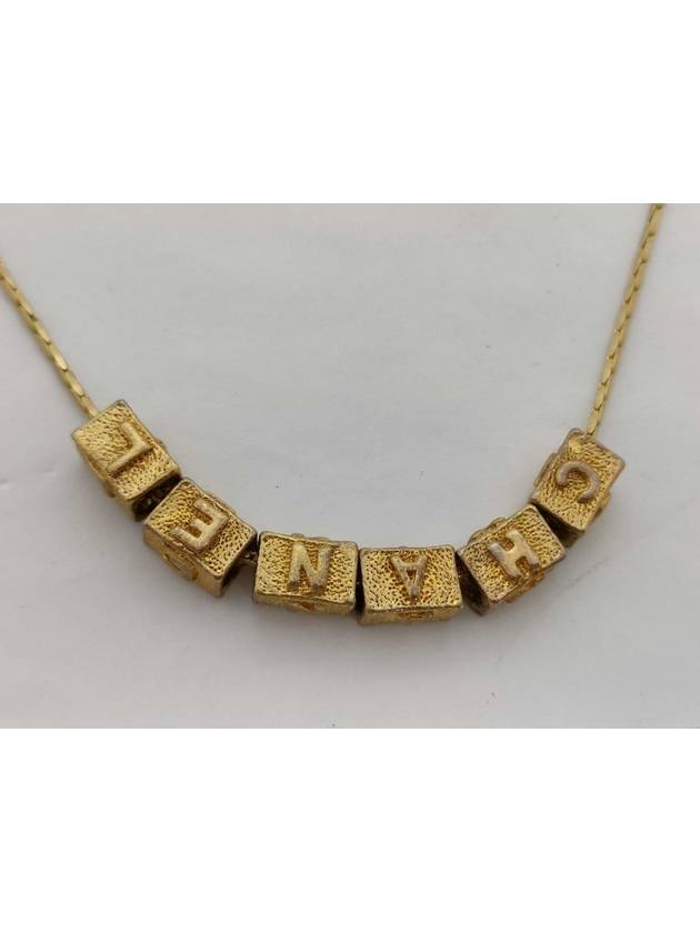 B Gold necklace Chanel