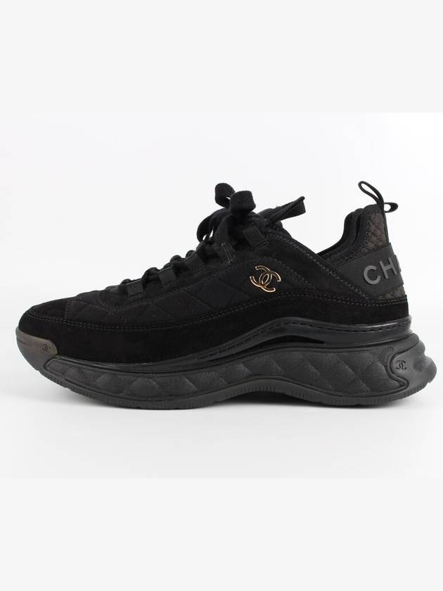 Mixed fiber black quilted gold sneakers 39 260 Chanel