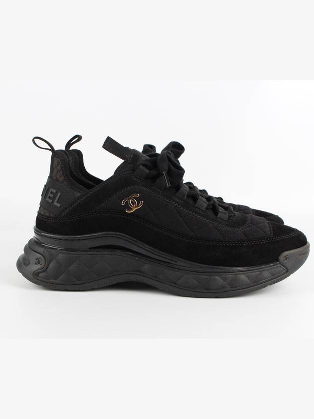 Mixed fiber black quilted gold sneakers 39 260 Chanel