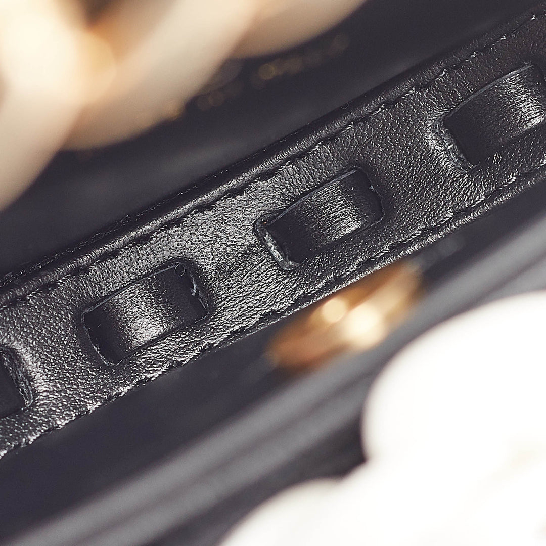 Chanel Black Quilted Leather Mini Round Camellia Clutch