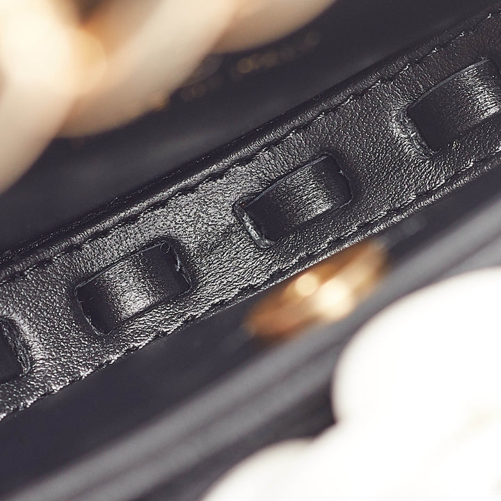 Chanel Black Quilted Leather Mini Round Camellia Clutch