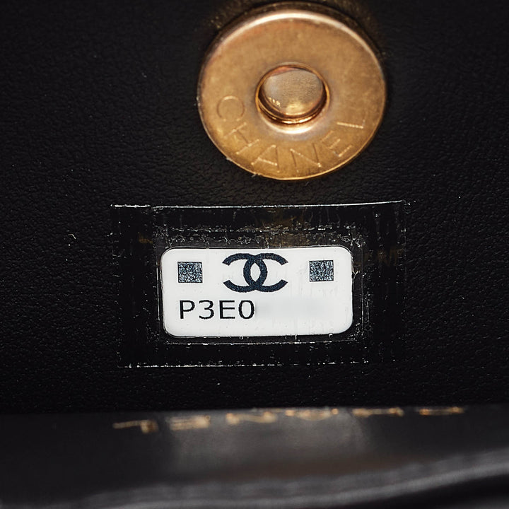Chanel Black Quilted Leather Mini Round Camellia Clutch